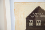 Detail of antique folk art carving, 'Peabody's General Store' text on dark board, aged background.