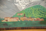 Colorful buildings of a village nestled into a green hillside in the antique painting.