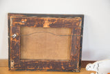 Reverse view of the antique painting showing its aged wood frame and canvas back.