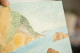 Textured brushstrokes of light blue water and rugged tan cliff in seascape painting.
