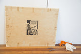 Aged back of the vintage painting's canvas board, showing 