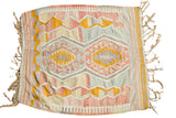 Vintage Kilim rug with faded pink, yellow, and grey geometric patterns and natural fringe.