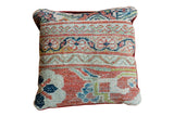 Antique Mahal rug pillow, turned inside out with faded coral and teal geometric patterns.