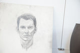 Right side of vintage pencil sketch of man, highlighting gray tones and paper texture.