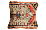Handmade Northwest Persian rug fragment pillow, central geometric pattern in camel, red, charcoal, and blue. 22x22.