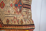Vintage Northwest Persian fragment pillow side view: hand-knotted geometric patterns in camel, red, charcoal, blue.