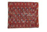 Distressed vintage Tekke square rug with madder root red, ivory, and dark blue geometric guls.