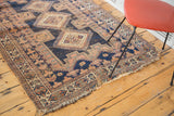 Aged fringe and geometric border pattern on the distressed antique Afshar rug.