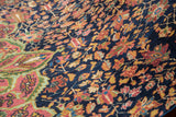 Brilliant gem-tone floral motifs on finely knotted Persian Farahan Sarouk rug.