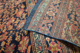 Finely knotted rose, green, gold floral border and blue selvage of Farahan Sarouk runner.