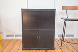 Prohibition Era antique hidden bar bureau, dark wood, subtle metallic hardware.