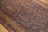 Intricate herati motif details of the antique Malayer rug in brilliant gem tones.