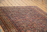 Antique Malayer rug border and intricate herati pattern in brilliant jewel tones.