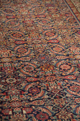 Antique Malayer rug runner showcasing intricate herati pattern and brilliant gem tones.