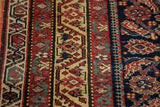 Detailed Herati motif and contrasting gem-tone reds, indigo, and saffron on antique Malayer rug.