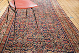 Antique Malayer runner with extensive herati pattern, rich indigo field, and gem-tone colors.