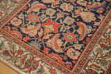 Distressed antique Malayer rug corner: navy field herati 'mahi-mahi' motifs and geometric floral border.