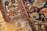 Antique Malayer rug, turned corner revealing distressed herati border and hand-knotted construction.