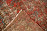 Antique Malayer rug corner, showing distressed cranberry rose Herati pile, exposed foundation, ivory fringe.