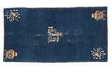 Cobalt blue antique Chinese Peking runner with floral corners, vase motifs, distressed aesthetic.