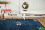 Distressed cobalt blue field with floral corner rendering on antique Chinese Peking runner.