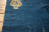 Cobalt blue distressed pile and vase motif detail of an antique Chinese Peking rug.