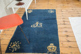 Cobalt blue antique Chinese Peking runner, showcasing its distressed field and floral motifs.