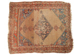 Antique distressed Halvai Bijar rug, expressive medallion on camel field with aqua and blush details.