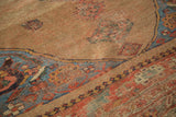 Worn pile texture of antique Halvai Bijar rug with muted camel field, aqua, and blush tones.