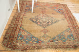 Antique Halvei Bijar rug, distressed camel field with expressive aqua and blush medallion.