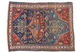 Collector Antique Seichor Kuba rug, medallion with animal motifs, indigo and cherry red.