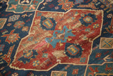 Antique Seichor Kuba rug, featuring distressed indigo blue and cherry red geometric motifs.