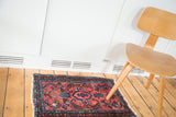 Distressed blush rose and sky blue hand knotted Lilihan rug with tattered fringe.