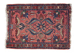 Distressed vintage Lilihan rug mat with blush rose field, scrolling floral vines in blue, red, green, 2'x2'8