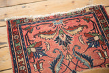 Tattered fringe and worn pile on a vintage distressed Lilihan rug's edge.
