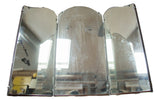 Antique tri-folding mirror with dark wooden backing and aged patina.