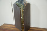 Antique tri folding mirror, partially closed, featuring dark wooden backing and rich patina.