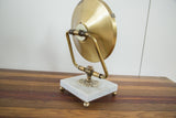 Mid Century Hollywood mirror back showing brass with spotting and marble base.