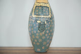 Vintage Folk Art Bowling Pin depicting a teal dress with orange flowers, hands, and basket.