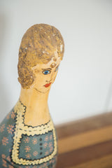 Vintage folk art bowling pin: painted blonde hair, blue eyes, floral blue-green dress.