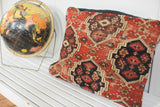 Antique Amu Darya rug fragment pillow, intricate geometric pattern, rich red, black, and beige.