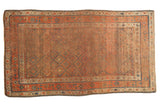 Distressed antique Kurdish rug with allover diamond geometric design, subdued rust and blue. Circa 1910.