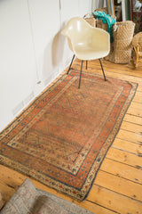 Distressed antique Kurdish rug corner, with allover diamond pattern and rich patina.