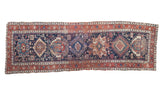 Distressed antique Karaja runner, indigo blue geometric medallions, madder red borders. 3'8