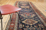 Distressed antique Persian Karaja runner, indigo field, madder red geometric motifs.