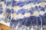 Hand-dyed blue and ivory pattern with long blue tassels on vintage African throw.