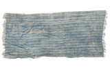 Vintage African indigo textile throw, hand-woven with intricate powder and light blue stripes, fringed.