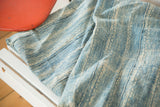 Intricate hand-woven texture and subtle dye variations of vintage African indigo throw.