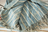 Hand-woven vintage African textile, indigo blue and natural striped cotton with fringed edges.