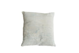 Pillow featuring faded vintage African Indigo textile, irregular blue tones and woven texture.